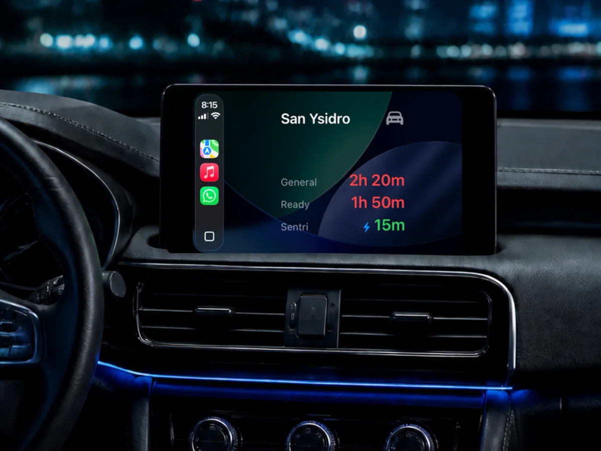 Car interior with Garitas on the CarPlay display showing San Ysidro wait times.